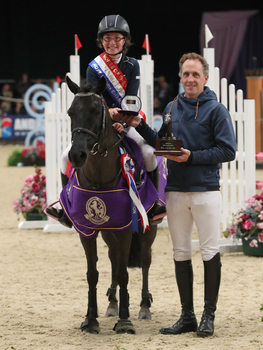 Amy Morris wins the 128cm Championship at Horse of the Year Show